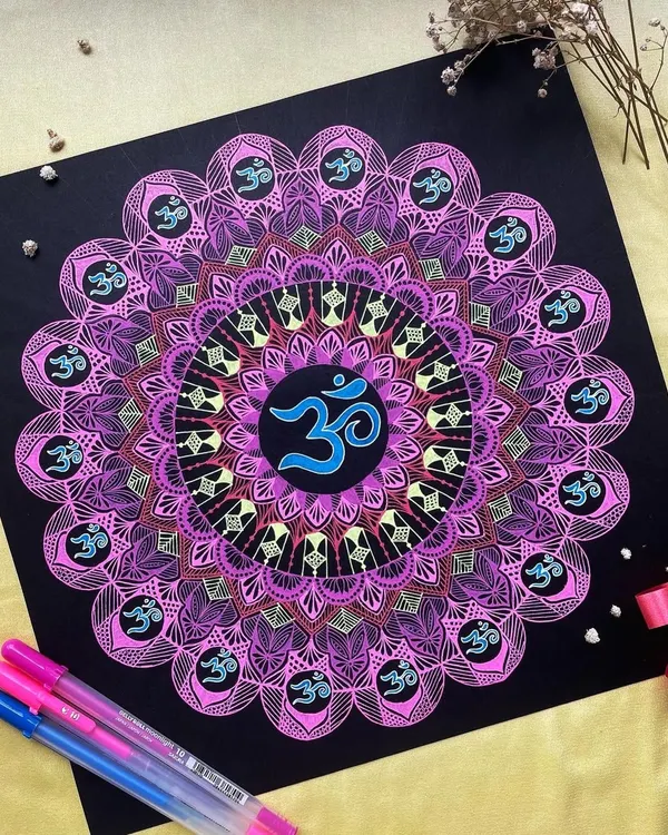 This 12-inch mandala features the sacred 'Om' symbol, drawn with vibrant gelly roll pens on black paper. The colors radiate outwards, creating a powerful spiritual artwork that brings a sense of peace and positive energy.