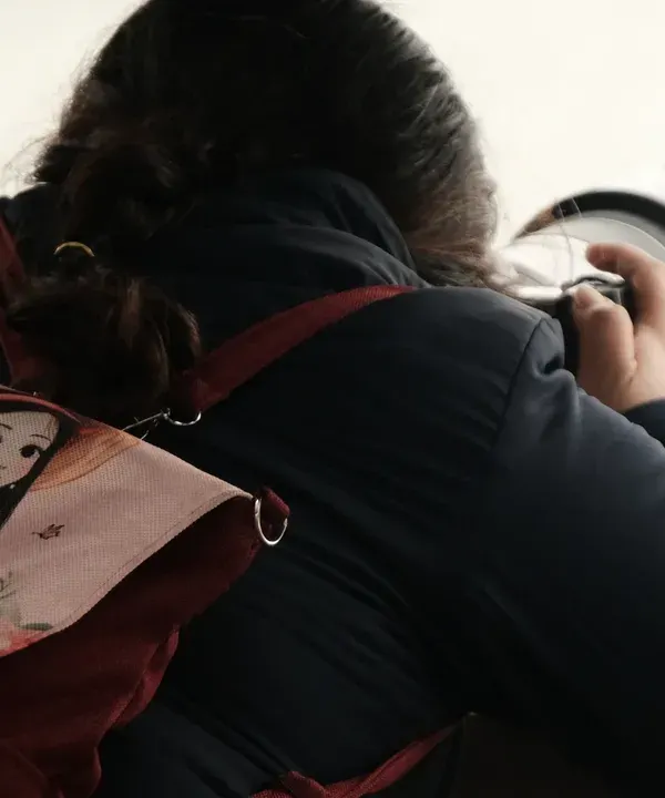 Me with my camera, looking for the next shot. My backpack and camera are my constant companions on this journey.