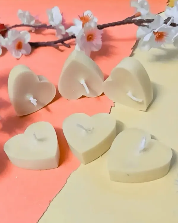 A simple arrangement of my cream-colored, heart-shaped soy wax tealights. These are unscented, perfect for those who prefer a simple, clean burn.
