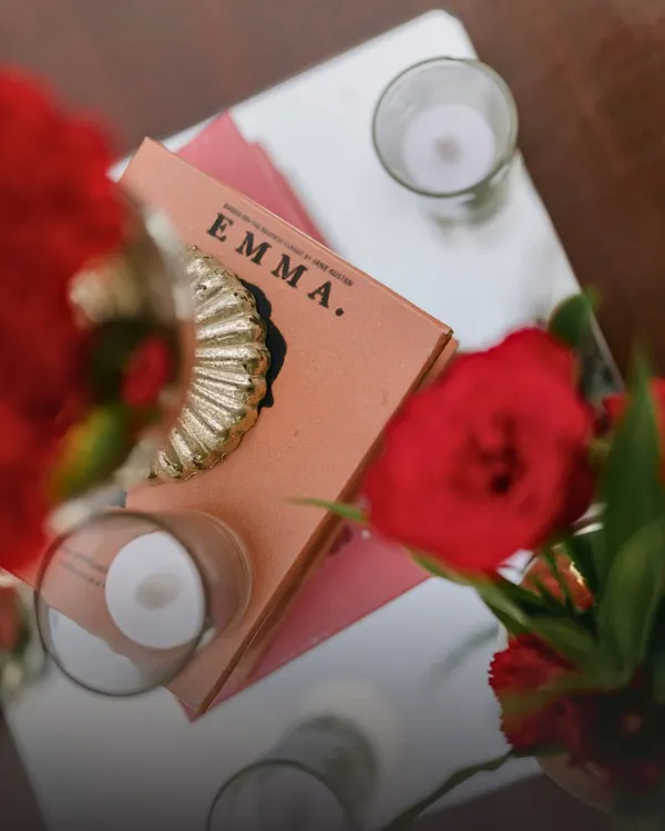 It's the personal touches that tell your story. For this book-loving couple's engagement, I used classic novels like 'Emma' as part of the decor, a subtle nod to their shared passion.