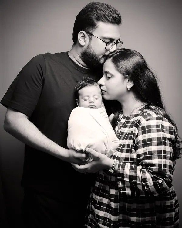 A timeless black and white family portrait with a newborn. My studio sessions are designed to be peaceful and safe, allowing us to capture the profound love of a new family.