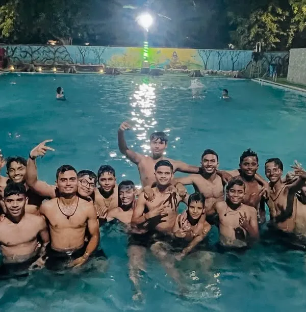 The team enjoying some well deserved downtime in the swimming pool during our Punjab tour. It's important to have fun and bond as a team.