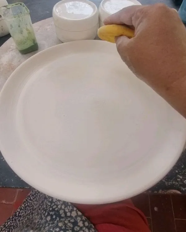 This is where it all begins, with a simple, smooth plate ready for decoration. A single piece like this can take hours to paint and carve, not including the time to make the plate, glaze it, and fire it.