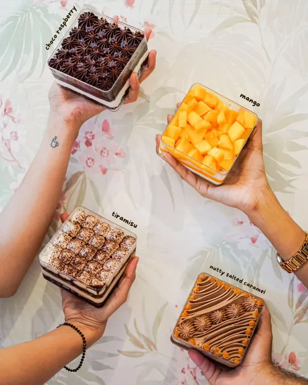 Our cake tubs are perfect for a party of one. Here are four of our most popular eggless flavors: Choco Raspberry, seasonal Mango, classic Tiramisu, and Nutty Salted Caramel.