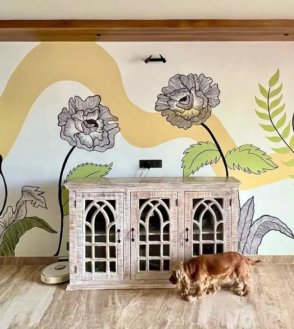 A full view of a 12x8 foot floral mural created for a client's home. The design combines delicate line work with soft color blocking to create a serene and artistic atmosphere.