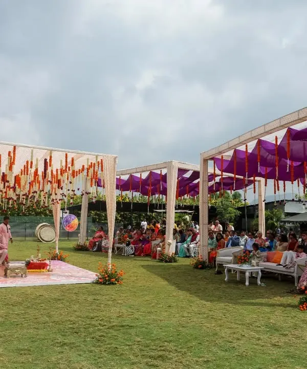 For the bride who dreamt of a purple Haldi, we brought her vision to life. This outdoor setup combines vibrant purple drapes with traditional orange marigolds, creating a unique and festive atmosphere for the ceremony.