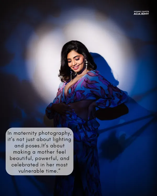 A dramatic maternity portrait using a spotlight effect, demonstrating creative and unconventional lighting techniques.
