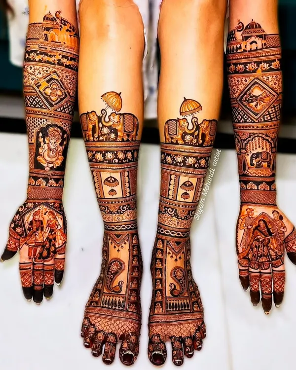 A complete bridal look, featuring exceptionally detailed mehandi on both hands and feet. This design includes traditional motifs like elephants and paisleys, demonstrating the full scope of my bridal packages.