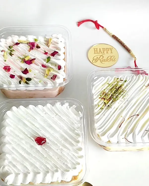 My signature Tres Leches tubs are a true comfort dessert, and here you can see the full range of my fusion flavors. I offer the Classic, a rich Rasmalai version with pista and saffron, and a fragrant Rose flavor that tastes just like falooda.