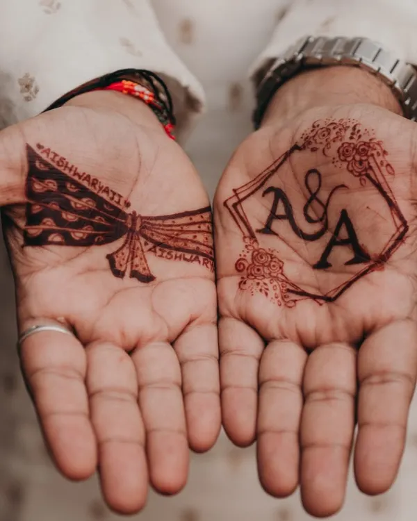 This geometric frame with the couple's initials is a perfect example of a modern groom mehendi design. It's bold, clean, and makes a statement while still feeling very personal and sophisticated.