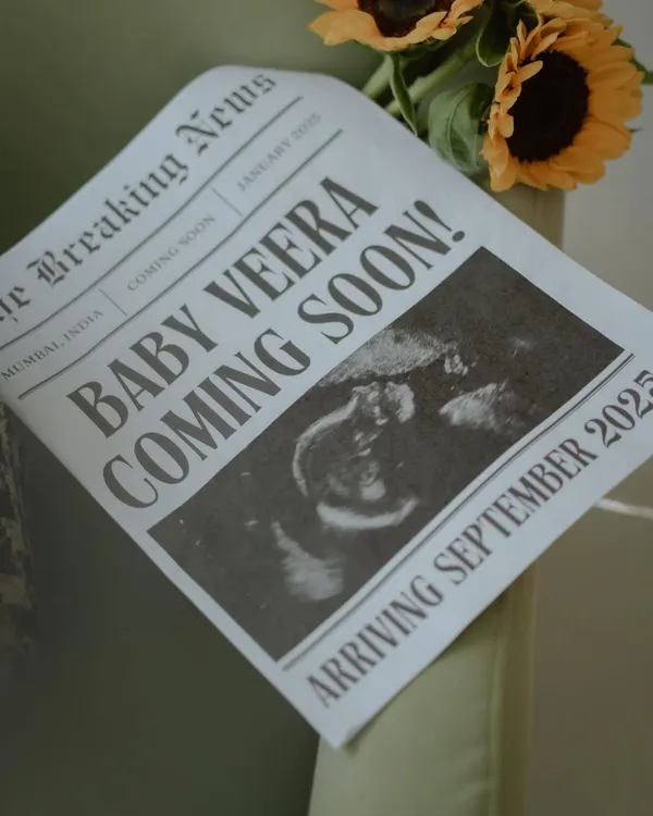A close-up of the custom newspaper pregnancy announcement. Every detail, from the headline "Baby Veera Coming Soon!" to the sonogram picture, is designed to be a cherished keepsake of this special news.