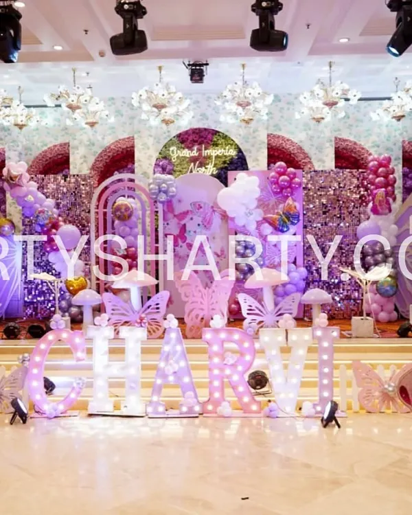 We design breathtaking main stages that become the centerpiece of your celebration. This butterfly princess theme combines intricate cutouts, soft balloon clouds, and marquee lighting to create a truly magical fairytale setting for the birthday girl.