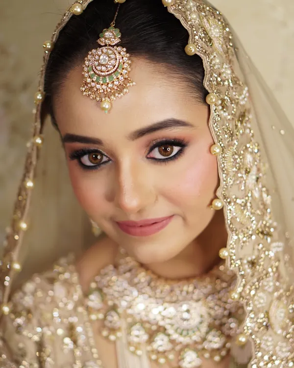 My ultimate goal is to reveal the radiance that is already within you. For this stunning bride, we chose a soft, regal look with sculpted eyes and a gentle rose-toned lip, allowing her natural beauty and magnificent jewels to shine. This is the essence of timeless bridal glamour.