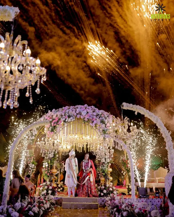 Under a sky full of fireworks and a canopy of florals, we craft the perfect 'I do' moment. This is where your forever begins, lit up by love and a touch of our signature magic.