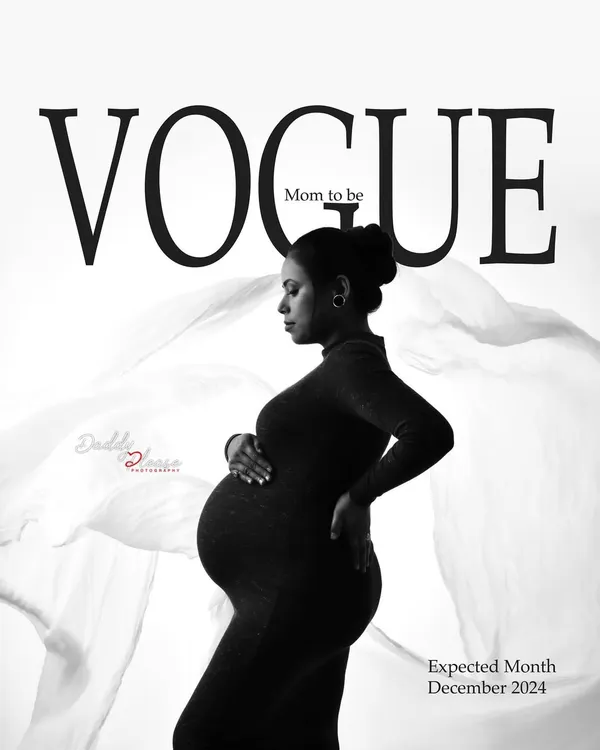 A striking black and white maternity portrait styled as a Vogue magazine cover. The mom-to-be wears a sleek, fitted black dress, creating a look that is both modern and timeless.