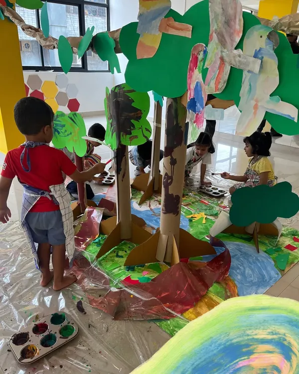 A glimpse into our "Art & Artists Around the World" camp, where we built an entire cardboard jungle. Children work together to paint trees, create animals, and construct a vibrant ecosystem, learning about collaboration and large-scale art.
