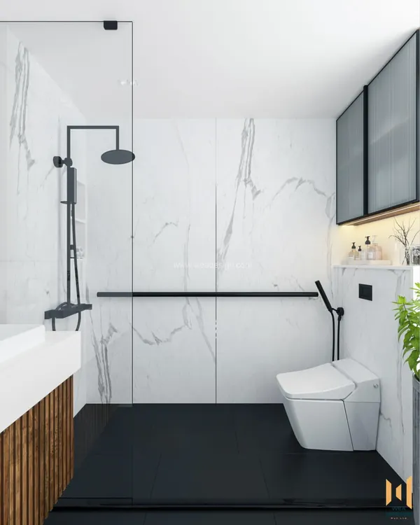 A modern bathroom at Svamitva Terravana, featuring white marble-patterned walls, black flooring, and sleek black fixtures for a high-contrast, luxurious feel.