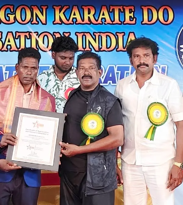 Honoring masters from the White Dragon Karate Do organization at their award ceremony. It is important to respect and support fellow martial artists in the community.