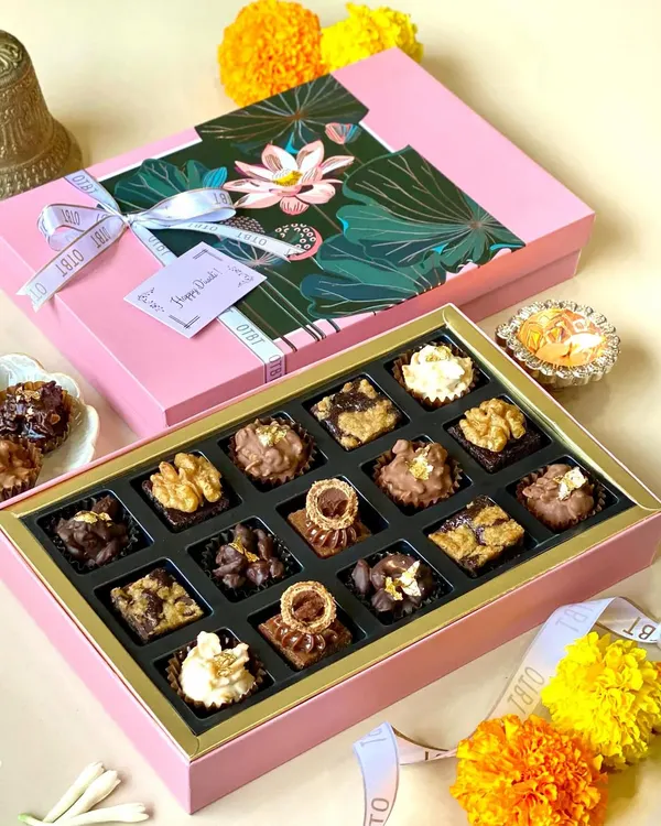 My Diwali collection is all about luxury and light. This premium pink box holds an assortment of 16 of my signature mini brownies, each with a unique topping, making it a perfect gift for sharing with family and friends.