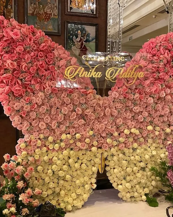 We crafted this breathtaking butterfly backdrop from hundreds of fresh pink and cream roses for a truly magical cradle ceremony. This statement piece creates a stunning focal point and a perfect photo opportunity, celebrating new life in the most beautiful way.