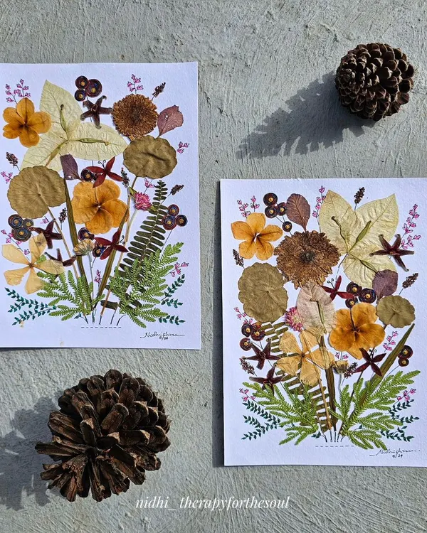 Two of my pressed flower art pieces, created with leaves and petals collected from my travels. Both of these original artworks are available for sale.