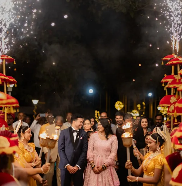 A grand reception entrance is a must. We love creating these "wow" moments for our couples, complete with sparklers, traditional performers, and an atmosphere of pure celebration that sets the tone for the entire night.
