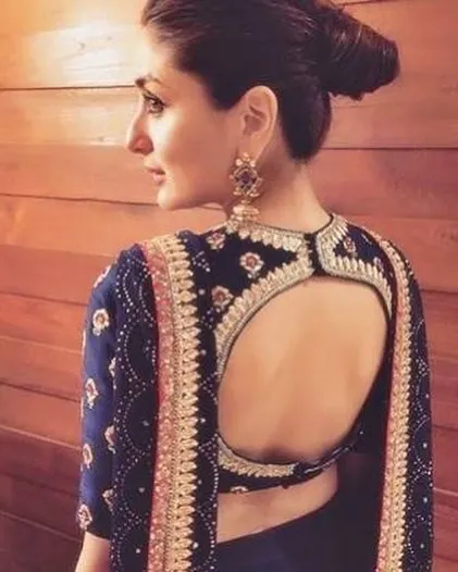 A popular and elegant keyhole back design on a navy blue embroidered blouse. We ensure the cut and fit are perfect, so you feel comfortable and confident.