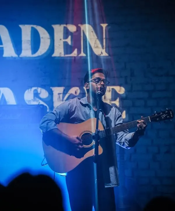 On stage under the lights at antiSOCIAL. Performing live is about creating a special atmosphere and sharing a moment with everyone in the room.