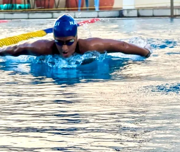 Our program is built on the foundation of powerful technique and relentless drive. This image captures one of our competitive swimmers executing a butterfly stroke with precision, showcasing the strength and form we cultivate in every athlete.