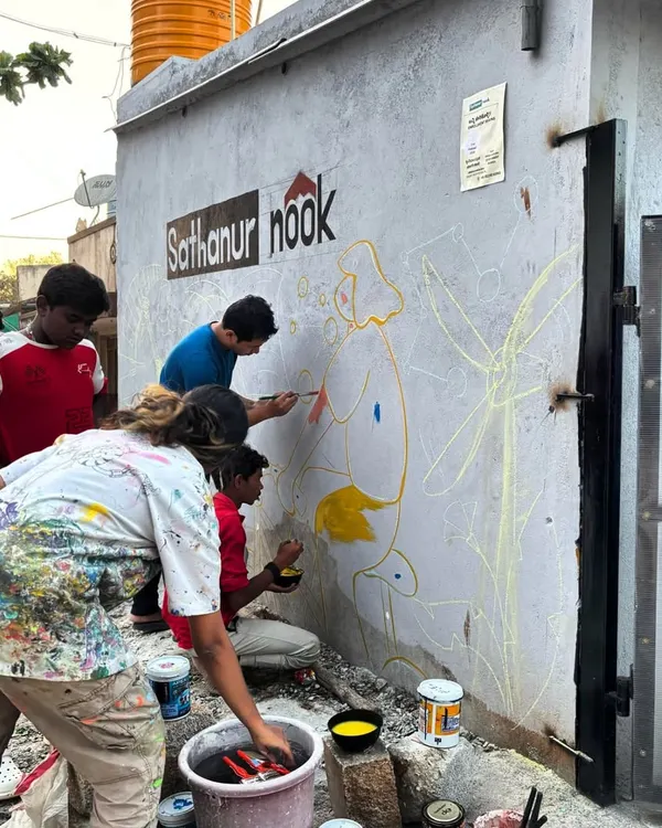 The beginning of every community mural is a mix of chalk lines and shared excitement. Here at Sathanur Nook with Project Defy, we started by outlining the vision, with community members of all ages eager to start painting and bring their wall to life.