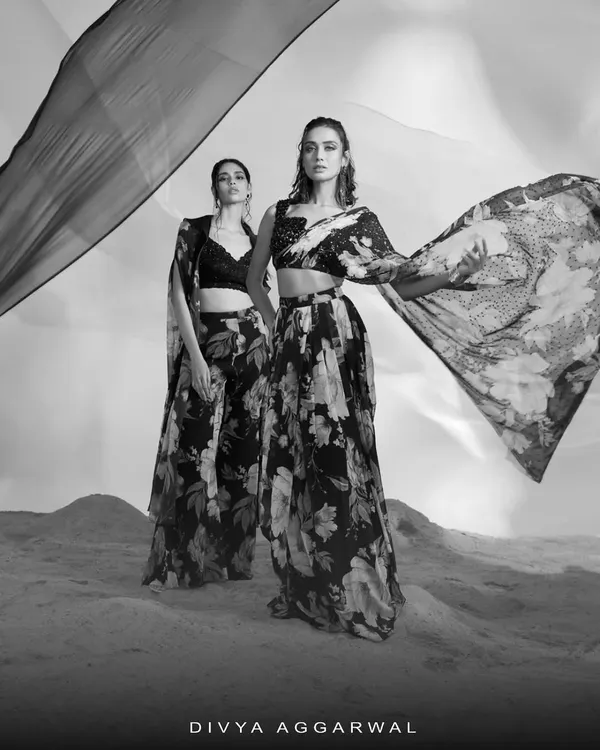 A black and white composition featuring two of my floral printed ensembles. I use monochrome photography to focus on the silhouette, movement, and interplay of patterns in my designs.