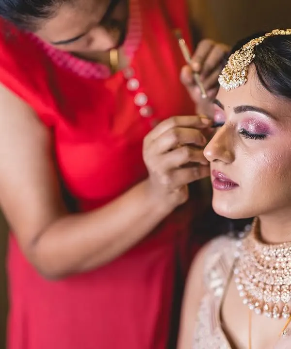 A behind the scenes shot of me working on a client's eye makeup. I take great care in every step, from blending the eyeshadows to placing the lashes, to create a look that is both beautiful and comfortable to wear.