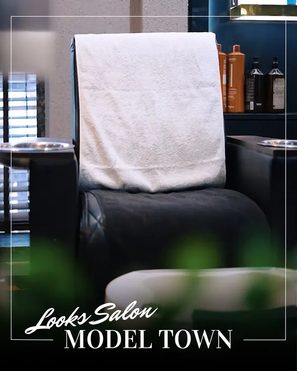 Your seat is waiting. This image shows one of our plush, comfortable pedicure chairs, ready for your next relaxation session in our clean and professional salon environment.