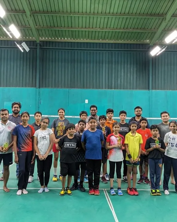 A group photo from one of our monthly badminton match days. It's all about healthy competition and having a great time on the court.