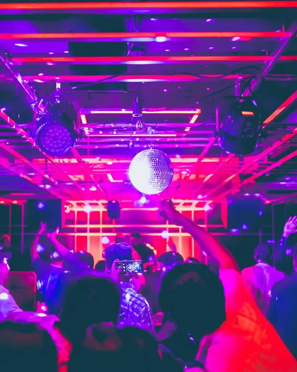 The classic disco ball and purple lights at Gawky Goose. I create a retro yet modern party atmosphere for my weekend events.
