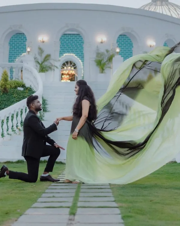 A proposal moment made even more magical. The ombre trail of this gown creates a beautiful frame for the couple, adding a sense of grandeur to this pre-wedding memory.
