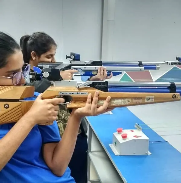 This is where focus begins. Here, a young camper takes aim with a professional-grade 10m air rifle, learning the fundamentals of stance, breathing, and trigger control in a safe and supervised setting.