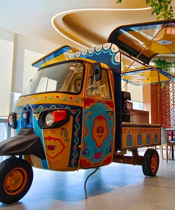 We took a simple auto-rickshaw and turned it into a canvas of Indian truck art. This upcycled sculpture, now the centerpiece of an office cafeteria, is a testament to how we blend vibrant culture with everyday objects to create functional art.