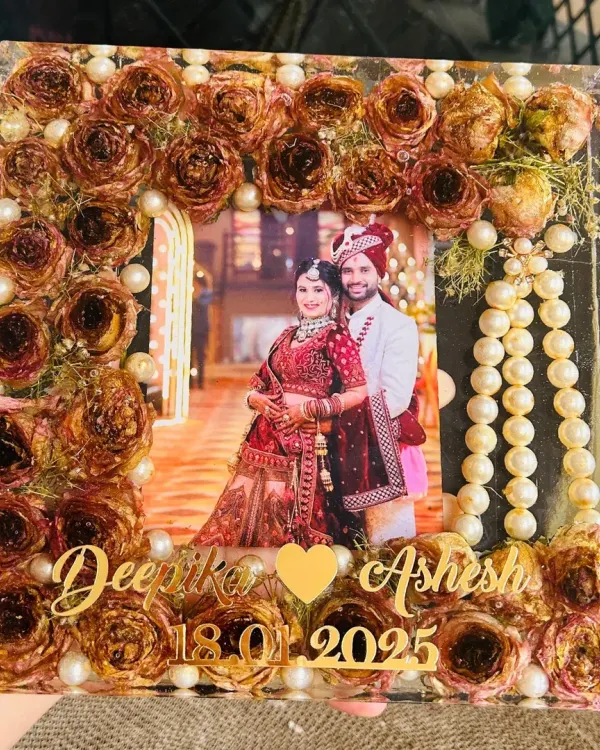 I preserve your most precious wedding memories, like this couple's varmala, in a stunning custom resin frame. This piece includes their names and wedding date, creating a timeless keepsake to display in your home.