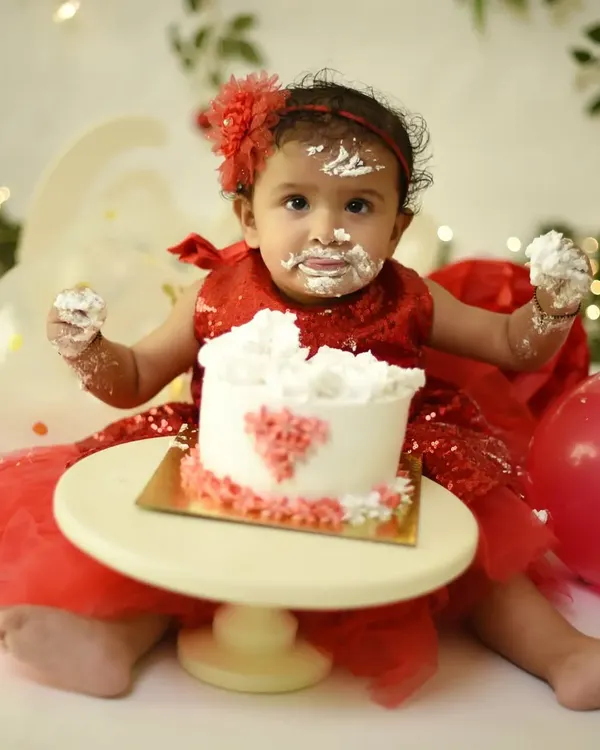 The best part of a cake smash is the pure, messy joy. This little one is having a blast, and I was right there to capture her adorable, frosting-covered smile. These sessions are all about fun.