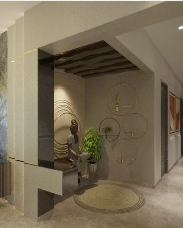 A concept for a peaceful meditation space. The design features a handcrafted Buddha statue on a wooden ledge, set against a textured wall with concentric circles that evoke a sense of calm.