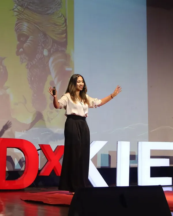 On stage for my TEDx talk, sharing my four-phase creative process: inhalation, assimilation, digestion, and exhalation. It was an honor to share the philosophy behind my art and my 'Travel and Paint' tour.