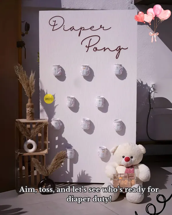 Aim, toss, and let's see who's ready for diaper duty! Our "Diaper Pong" game is always a huge hit at baby showers, bringing out everyone's competitive and fun side.