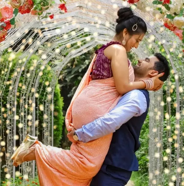 A magical pre-wedding moment, where we used a beautiful floral arch and fairy lights to create a romantic, cinematic feel for the couple.