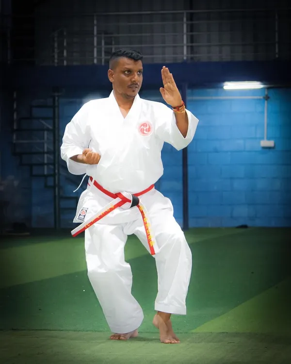 As your personal instructor, I demonstrate the precise form and posture required in Okinawa Shorin-Ryu Karate. This stance, a foundational element of our training, builds balance, stability, and power from the ground up.