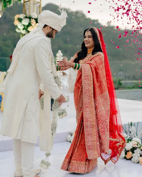 A beautiful candid moment from Shweta's wedding. The flower shower, the smiles, and her natural glow are just everything. This is the kind of soft bridal glam I love to create.