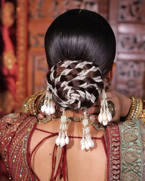 This intricate bridal bun features a beautiful woven pattern with silver highlights. This is an advanced technique that I teach in my hairstyling diploma course.