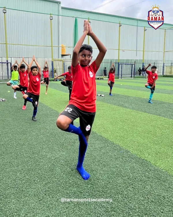 Our young players practicing the tree pose during our World Yoga Day celebration, finding balance and focus.