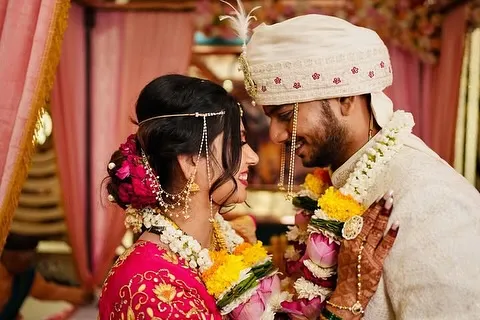 An intimate moment between the bride and groom. Her soft glam makeup and his natural, polished look are in perfect harmony.