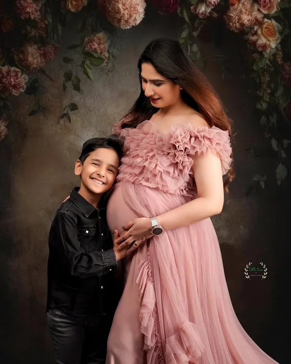 A beautiful moment between a mother, her son, and her baby bump. Capturing the excitement of a big brother-to-be is so special.